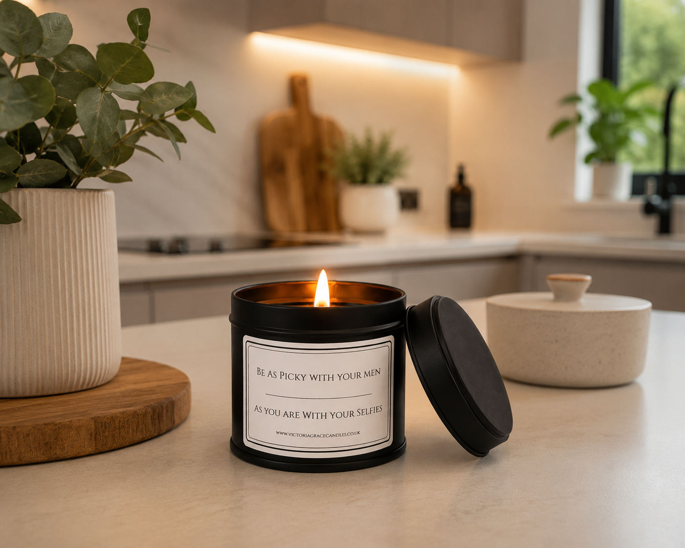 Black tin candle with the word be as picky with your men as you are with your selfies on it in a modern kitchen