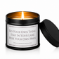 Luxury black soy wax candle with the words "Do Your Own Thing, Stay In Your Lane, Ride Your Own Wave" on a white background with the black lid resting beside the candle.