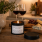 black tin candle with the words don't let others get you down on it set in a cosy environment