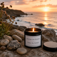 Luxury soy wax candle overlooking the ocean with waves, golden sunset light and a relaxing coastal backdrop.
