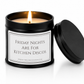 A black metal candle tin with a lit candle and its lid leaning against it on a white background. The front label reads 'FRIDAY NIGHTS ARE FOR KITCHEN DISCOS' with a small website at the bottom.