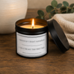 Lit Victoria Grace Candles soy wax candle with "Obviously I Don't Look Busy, I Did It Right the First Time" label in a warm, cosy home setting.