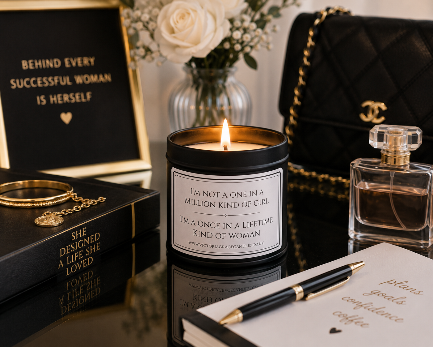 A lit candle in a black jar with a white label reading, 'I'M NOT A ONE IN A MILLION KIND OF GIRL. I'M ONCE IN A LIFETIME KIND OF WOMAN.