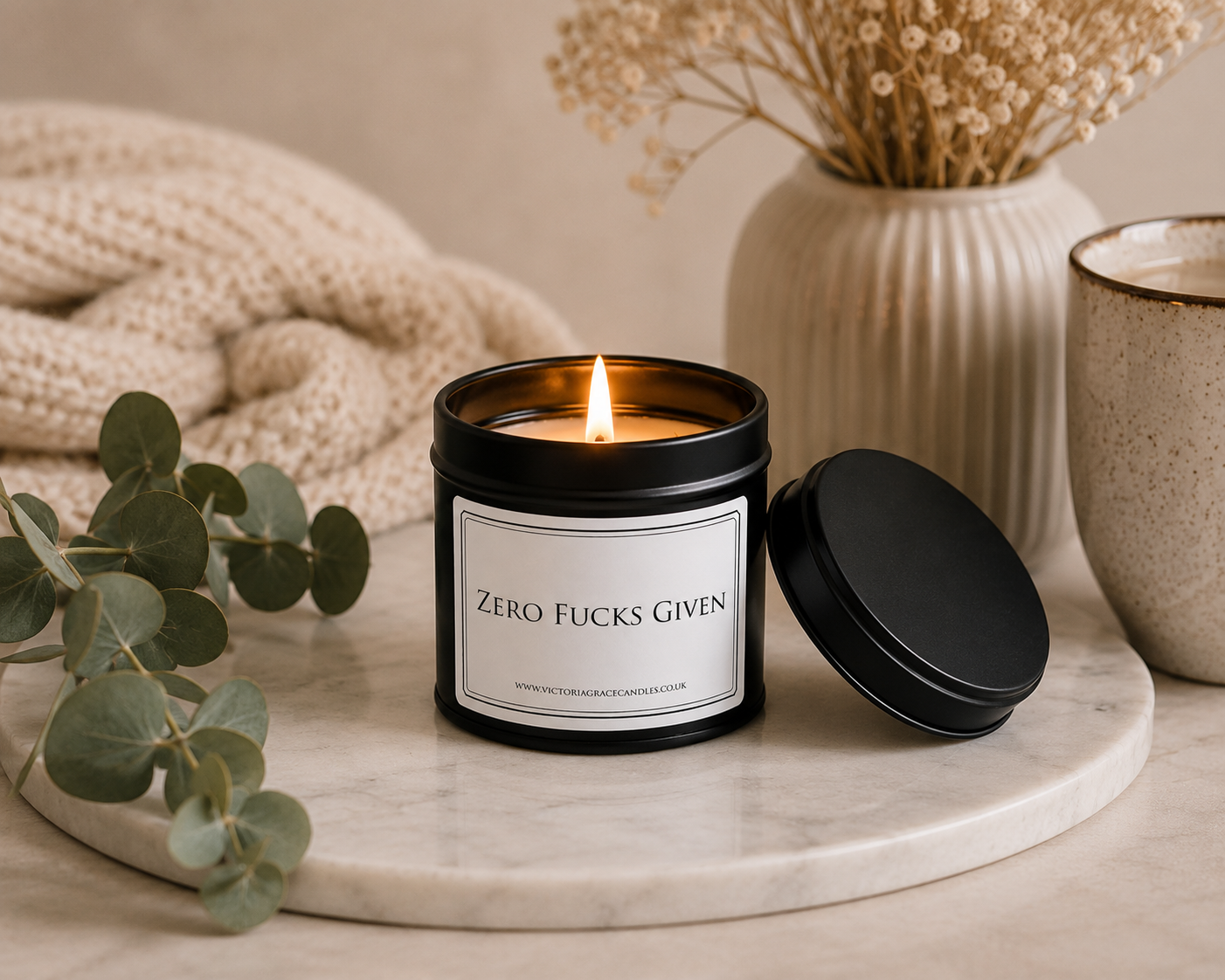 Luxury soy wax candle on a marble tray with eucalyptus, dried flowers and soft neutral décor, creating a peaceful spa-inspired atmosphere.