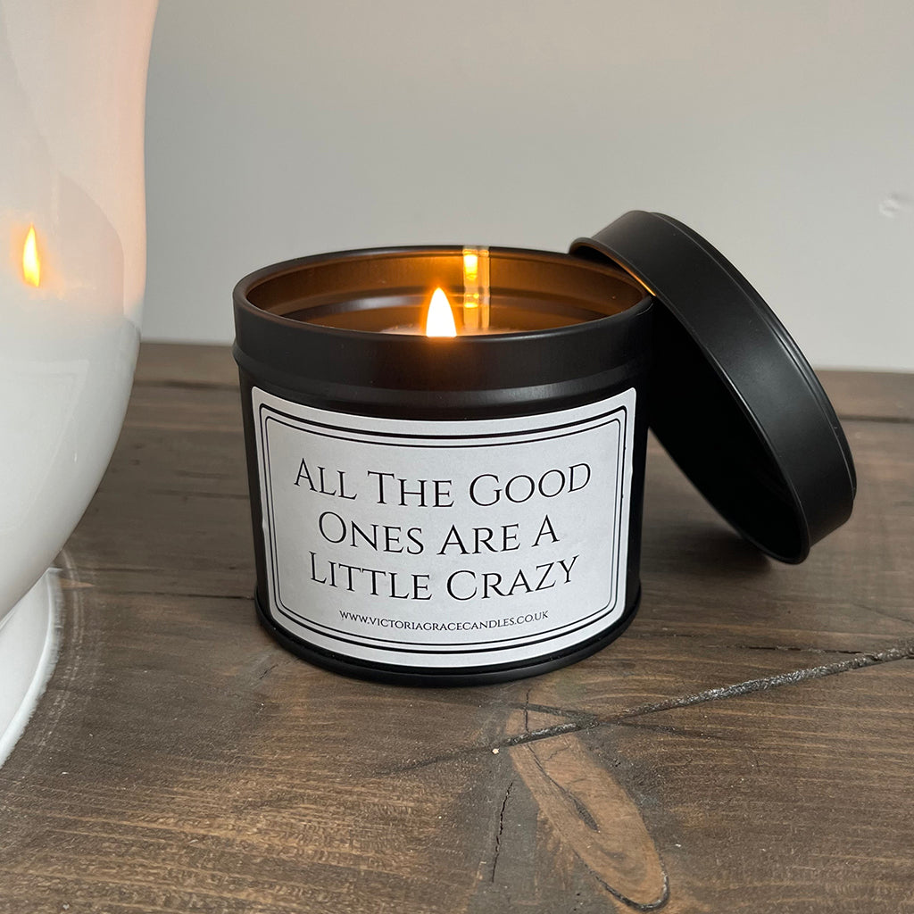 all the good ones are a little crazy black tin candle