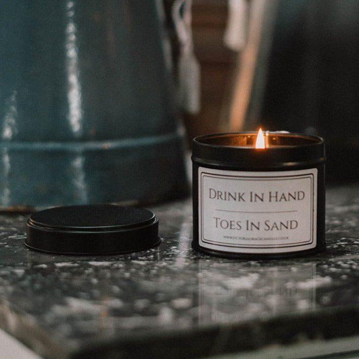 Drink In Hand Toes In Sand black tin Candle