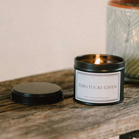 Zero Given black tin Candle